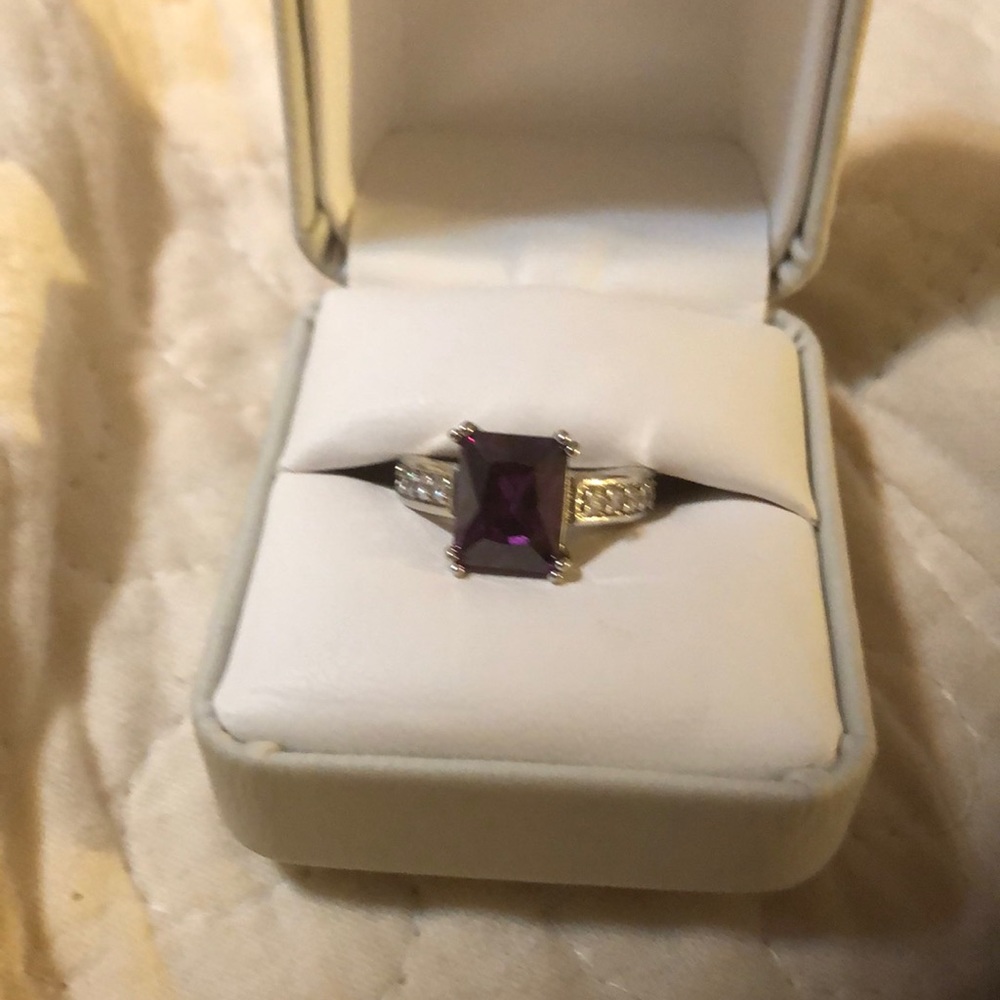 Amethyst color ring size 7. New. Cubic zirconia along sides.